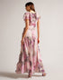 KARENIE-Dresses-The softest and most graceful maxi dress, KARENIE features a blurred floral print and finished with stunning waterfall frills that cascade down the front. Style yours with strappy sandals and minimal jewellery for an effortless look that will take you effortlessly through the season.The fabric of this product is made with 55% recycled polyester. Using recycled polyester helps divert plastic waste from ending in landfills, and helps us to reduce our dependence on virgin materials. Maxi dress